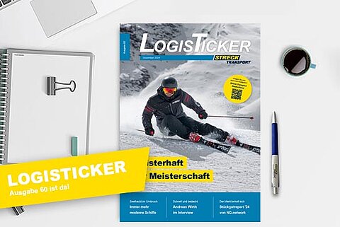 Die 60. Ausgabe der Streck Transport-Kundenzeitschrift LogisTicker liegt auf einem Schreibtisch mit Kugelschreiber, Notizblock und Kaffeetasse